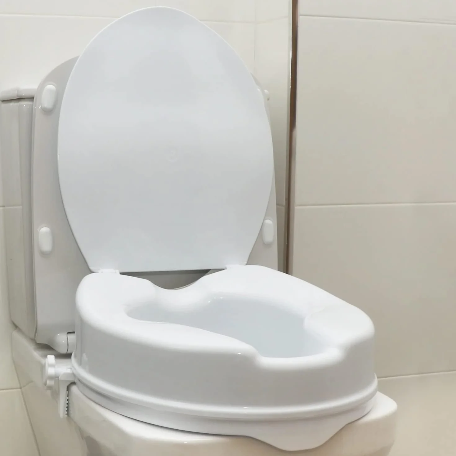 OrtoPrime Podwyższenie toalety dla osób niepełnosprawnych z pokrywką – wysokość 10 cm – ortopedyczny alzawater z bocznym systemem zabezpieczającym - uniwersalne, regulowane podnoszenie toalety